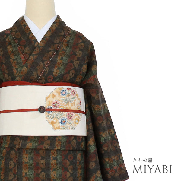 紬 リサイクル 身丈166cm 裄65.6cm 袷 絞り 縞柄 ブラウン ゆったりLLサイズ カジュアル しつけ糸 正絹 広衿 Sランク