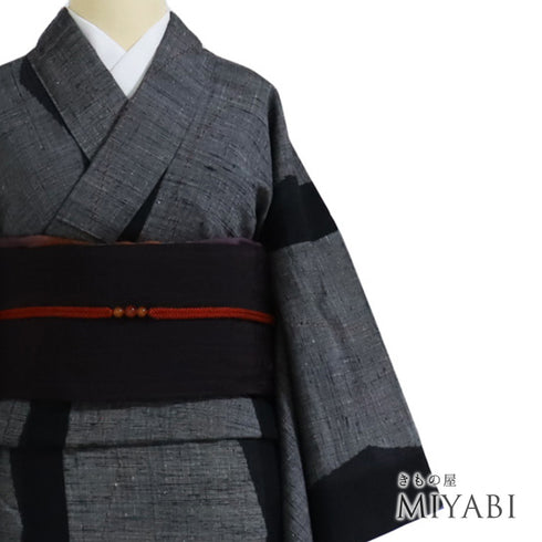 紬 リサイクル 身丈162cm 裄65cm 袷 幾何学模様 織り出し柄 ブラック Lサイズ お洒落 カジュアル 正絹 広衿 Sランク