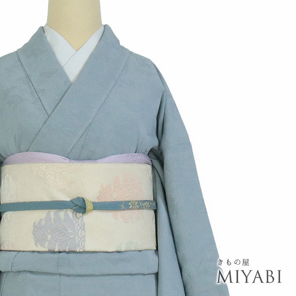 色無地 リサイクル 身丈152.8cm 裄66.4cm 袷 波頭柄 ブルー Sサイズ セミフォーマル お洒落 一つ紋 しつけ糸 正絹 広衿 地紋あり Sランク