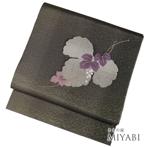 名古屋帯 リサイクル 帯丈383cm ポイント柄 葡萄柄 綴れ織り はればれ加工 ブラウン Lサイズ 正絹 新品・未使用品 お洒落 落款