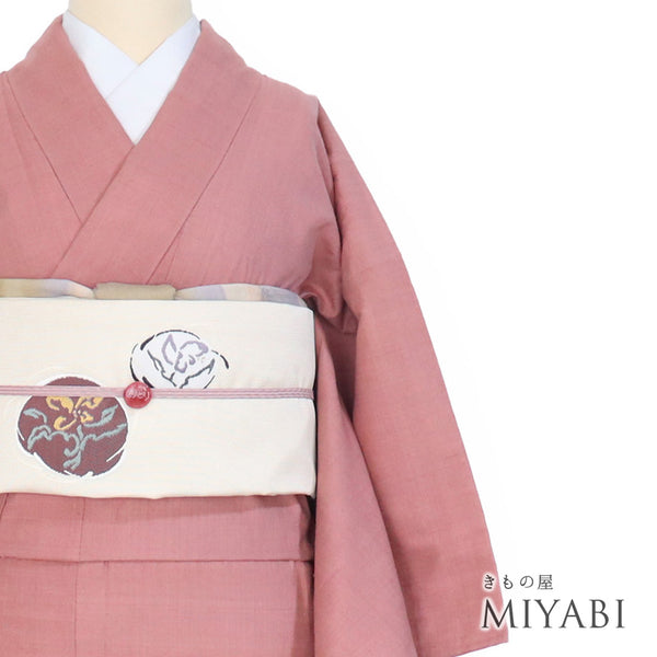 結城紬 リサイクル 身丈164.8cm 裄65.2cm 単衣 ピンク Lサイズ お洒落 カジュアル 証紙 一つ紋 しつけ糸 正絹 広衿 Sランク