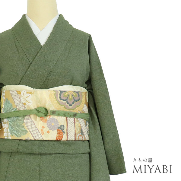 小紋 リサイクル 身丈156.7cm 裄63.4cm 袷 お召し 地紋 グリーン Mサイズ お洒落 セミフォーマル 一つ紋 しつけ糸 正絹 広衿 未使用品