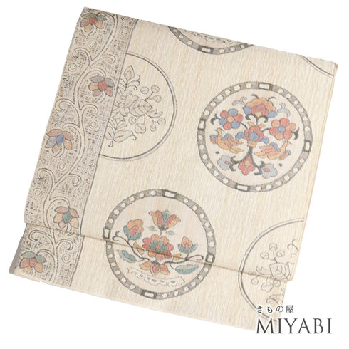 袋帯 リサイクル 帯丈426cm 六通 丸に花柄 デザイン唐花柄 ベージュ Sサイズ 正絹 新品・未使用品 お洒落