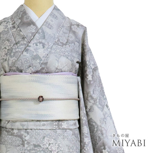 紬 リサイクル 身丈161.3cm 裄65.6cm 袷 地紙に松や花柄 麻の葉柄 グレー Lサイズ カジュアル しつけ糸 正絹 広衿 Sランク