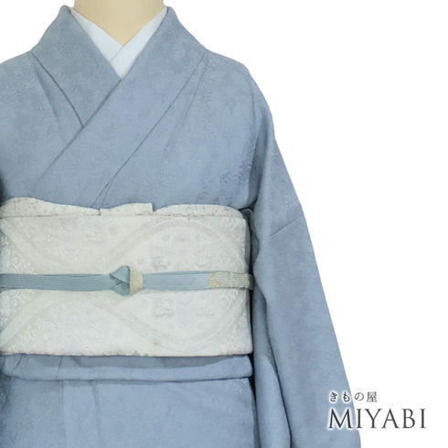 色無地 リサイクル 身丈162.5cm 裄66.8cm 袷 草木柄 ブルー Lサイズ セミフォーマル お洒落 一つ紋 正絹 広衿 地紋あり Sランク
