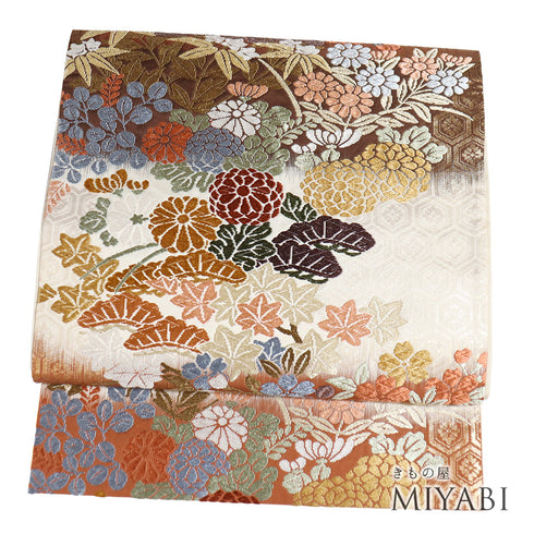 袋帯 リサイクル 帯丈424cm 六通 松や菊に草花模様 刺繍 唐錦 四季草花文 ブラウン Sサイズ 正絹 Sランク フォーマル セミフォーマル