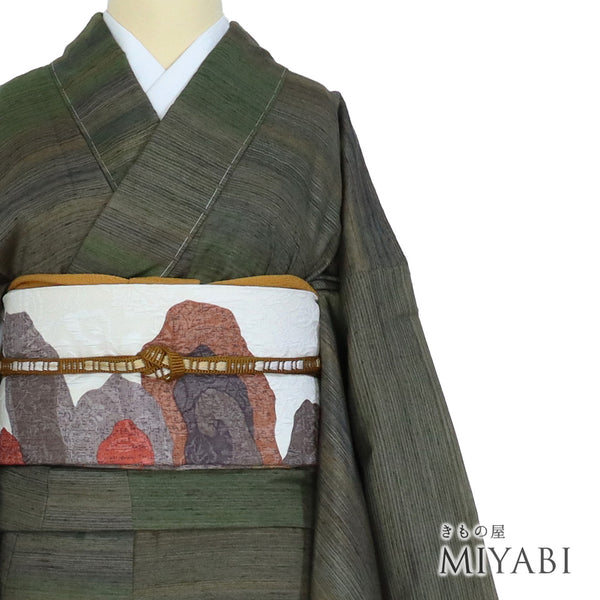 紬 リサイクル 身丈162cm 裄66cm 袷 グリーン Lサイズ カジュアル お洒落 しつけ糸 正絹 広衿 Sランク