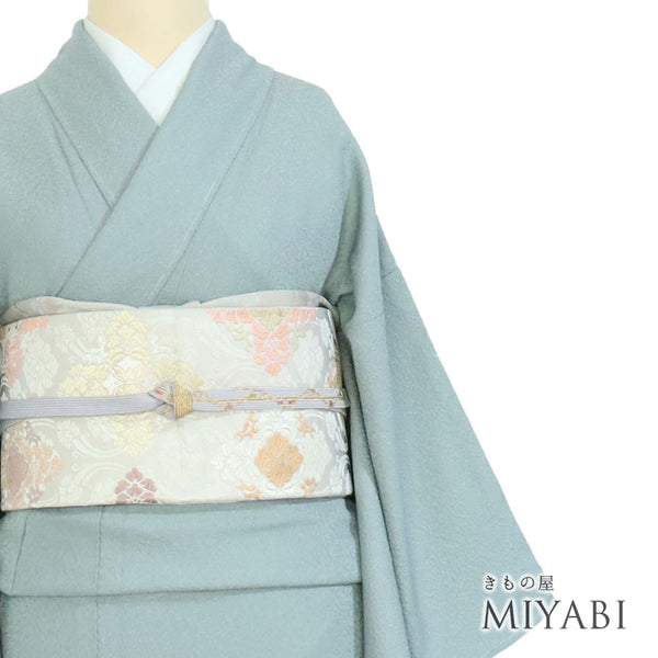 色無地 リサイクル 身丈156.4cm 裄62.7cm 袷 作家物 瑞寶 グリーン Mサイズ セミフォーマル 落款 一つ紋 しつけ糸 正絹 広衿 地紋あり Sランク