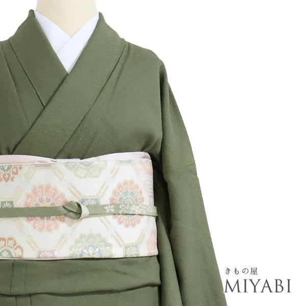 色無地 リサイクル 身丈161cm 裄68.8cm 袷 グリーン Lサイズ セミフォーマル 一つ紋 正絹 広衿 地紋あり Sランク