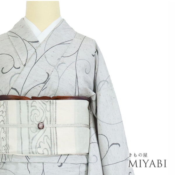紬 リサイクル 身丈155.5cm 裄64.6cm 単衣 ぜんまい織 唐草模様 グレー Mサイズ カジュアル お洒落 証紙 混合 洗える着物 広衿 Sランク