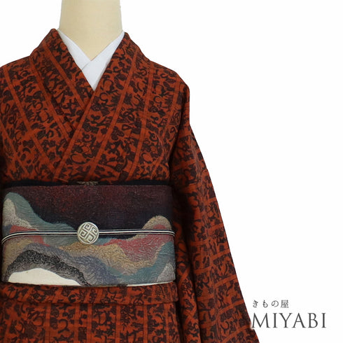 小紋 リサイクル 身丈158.3cm 裄62.8cm 単衣 いろは歌柄 オレンジ Mサイズ お洒落 しつけ糸 正絹 広衿 Sランク