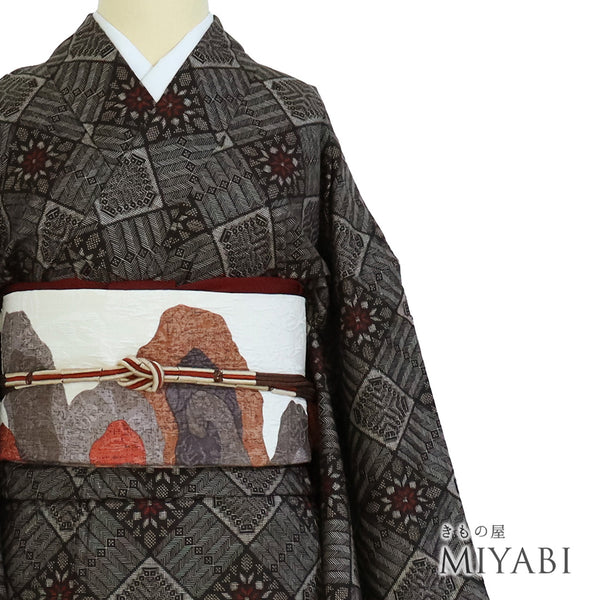 紬 リサイクル 身丈157cm 裄66.8cm 袷 大島紬 龍郷柄 ブラウン Mサイズ カジュアル 正絹 バチ衿 Sランク