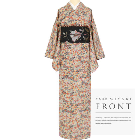 小紋 リサイクル 身丈157cm 裄64.6cm 袷 源氏車に菊柄 オレンジ Mサイズ お洒落 カジュアル しつけ糸 正絹 広衿 Sランク