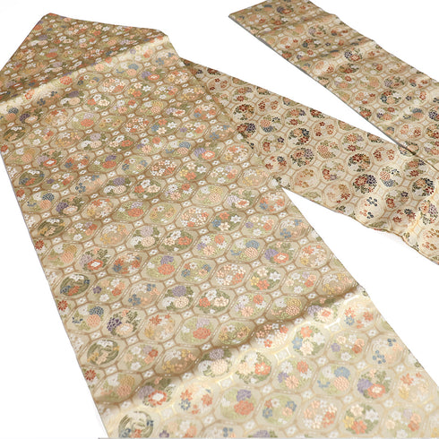 名古屋帯 リサイクル 帯丈365cm 六通 蜀江文 四季花模様 九寸 ベージュ Mサイズ 正絹 Sランク セミフォーマル お洒落