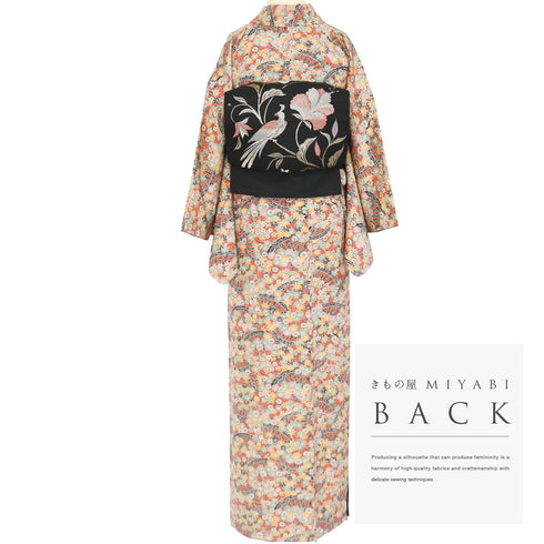 小紋 リサイクル 身丈157cm 裄64.6cm 袷 源氏車に菊柄 オレンジ Mサイズ お洒落 カジュアル しつけ糸 正絹 広衿 Sランク