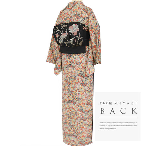 小紋 リサイクル 身丈157cm 裄64.6cm 袷 源氏車に菊柄 オレンジ Mサイズ お洒落 カジュアル しつけ糸 正絹 広衿 Sランク