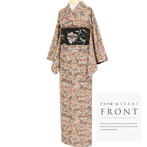 小紋 リサイクル 身丈157cm 裄64.6cm 袷 源氏車に菊柄 オレンジ Mサイズ お洒落 カジュアル しつけ糸 正絹 広衿 Sランク