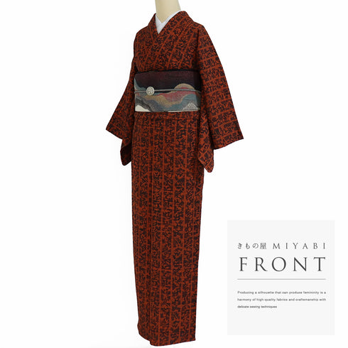 小紋 リサイクル 身丈158.3cm 裄62.8cm 単衣 いろは歌柄 オレンジ Mサイズ お洒落 しつけ糸 正絹 広衿 Sランク